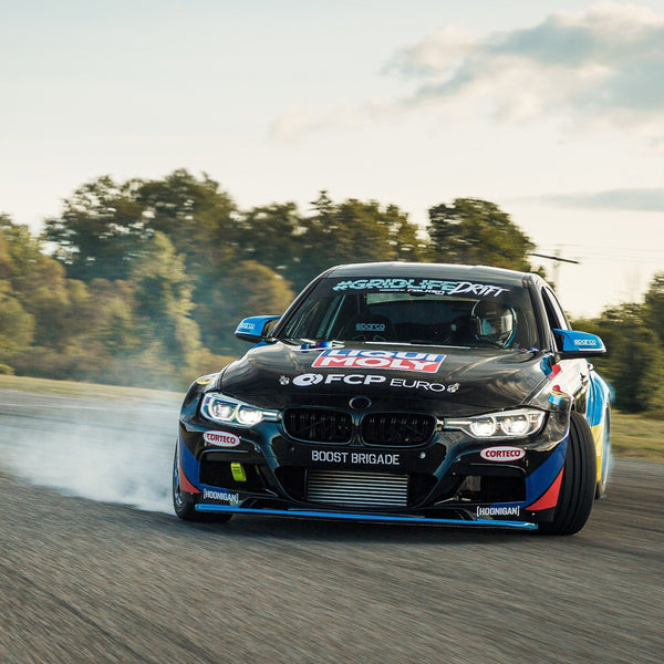 A BMW F30 drift car with AKG Motorsport motor mounts and bushings at Gridlife Midwest Festival.