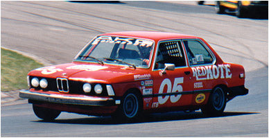 A classic red BMW race car built by AKG Motorsport with AKG performance parts at Road America.