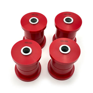 Set of red polyurethane rear trailing arm bushings (rtab) for BMW E28, E34. Made in USA by AKG Motorsport.
