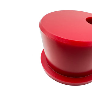 Close up of red polyurethane 75D front control arm bushings (fcab) for BMW E30, E36, Z3. Offset style. Made in USA by AKG Motorsport.