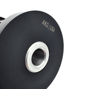 Close up of black polyurethane 95A subframe bushings for BMW E30. Made in USA by AKG Motorsport.