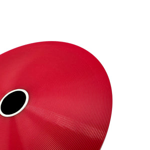 Close up of red polyurethane 75D diff bushing for BMW E30, Z3, 318ti. Made in USA by AKG Motorsport.