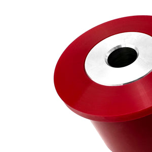 Close up of red polyurethane 75D diff bushings for BMW E36. Made in USA by AKG Motorsport.
