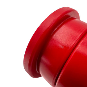 Close up of red polyurethane 75D rear trailing arm bushings (rtab) for BMW E36, E46, Z4. Made in USA by AKG Motorsport.