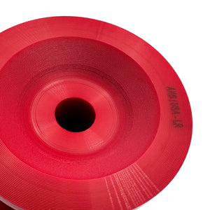 Close up of red polyurethane 75D rear subframe bushings for BMW E90, E92, E82. Made in USA by AKG Motorsport.