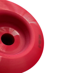 Close up of red polyurethane 75D rear subframe bushings for BMW E90, E92, E82. Made in USA by AKG Motorsport.