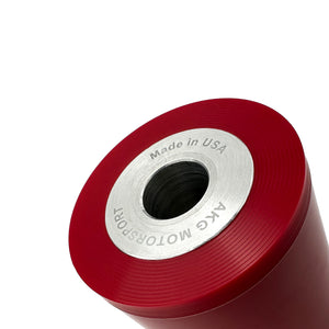 Close up of red polyurethane 75D diff bushings for BMW E90/E92 M3, E82 M. Made in USA by AKG Motorsport. 