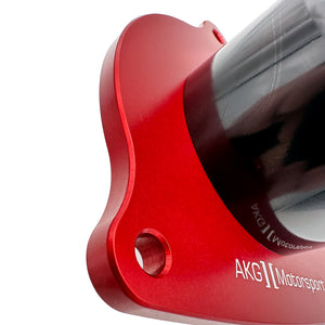 Close up of red polyurethane motor mounts for BMW F10, F06, F12. Made in USA by AKG Motorsport.