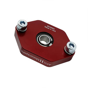 Close up of red BMW E90, E92, E82 lower rear shock mounts with bearings (race). Made in USA by AKG Motorsport.