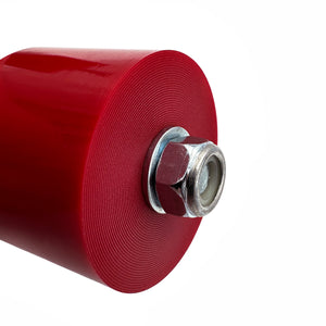 Close up of red polyurethane trans mounts for BMW E30, E36, E46, E82, E90, E92, F22, F30, F32, F80, F82, F87, Z3, Z4. Made in USA by AKG Motorsport. 